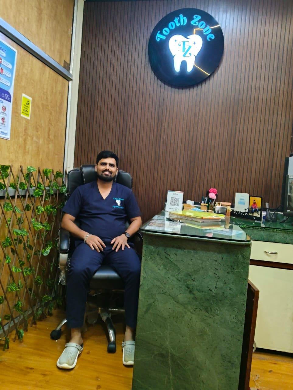 Dr. Parvez Musharraf at his clinic desk